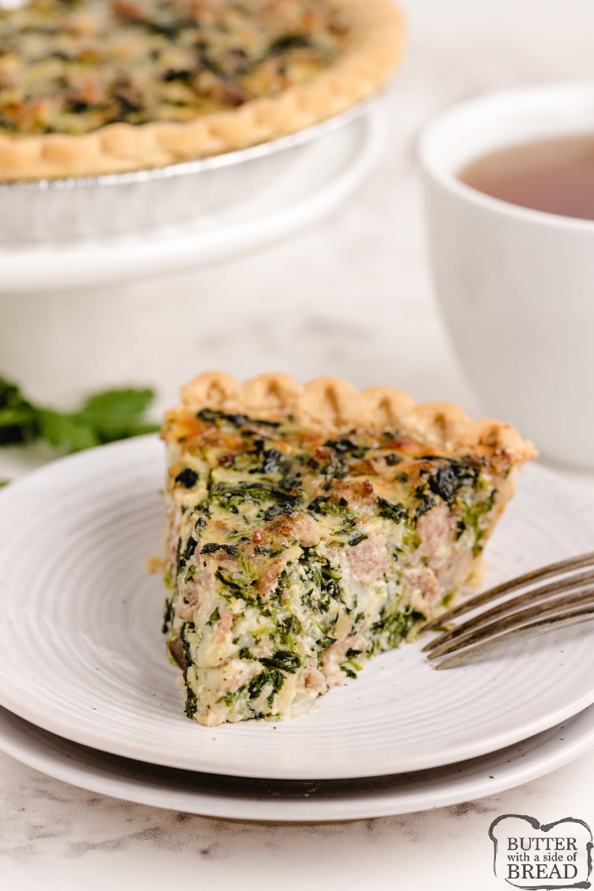 Best Quiche recipe made with spinach, sausage, mushrooms and three kinds of cheese! Easy quiche recipe that is delicious!