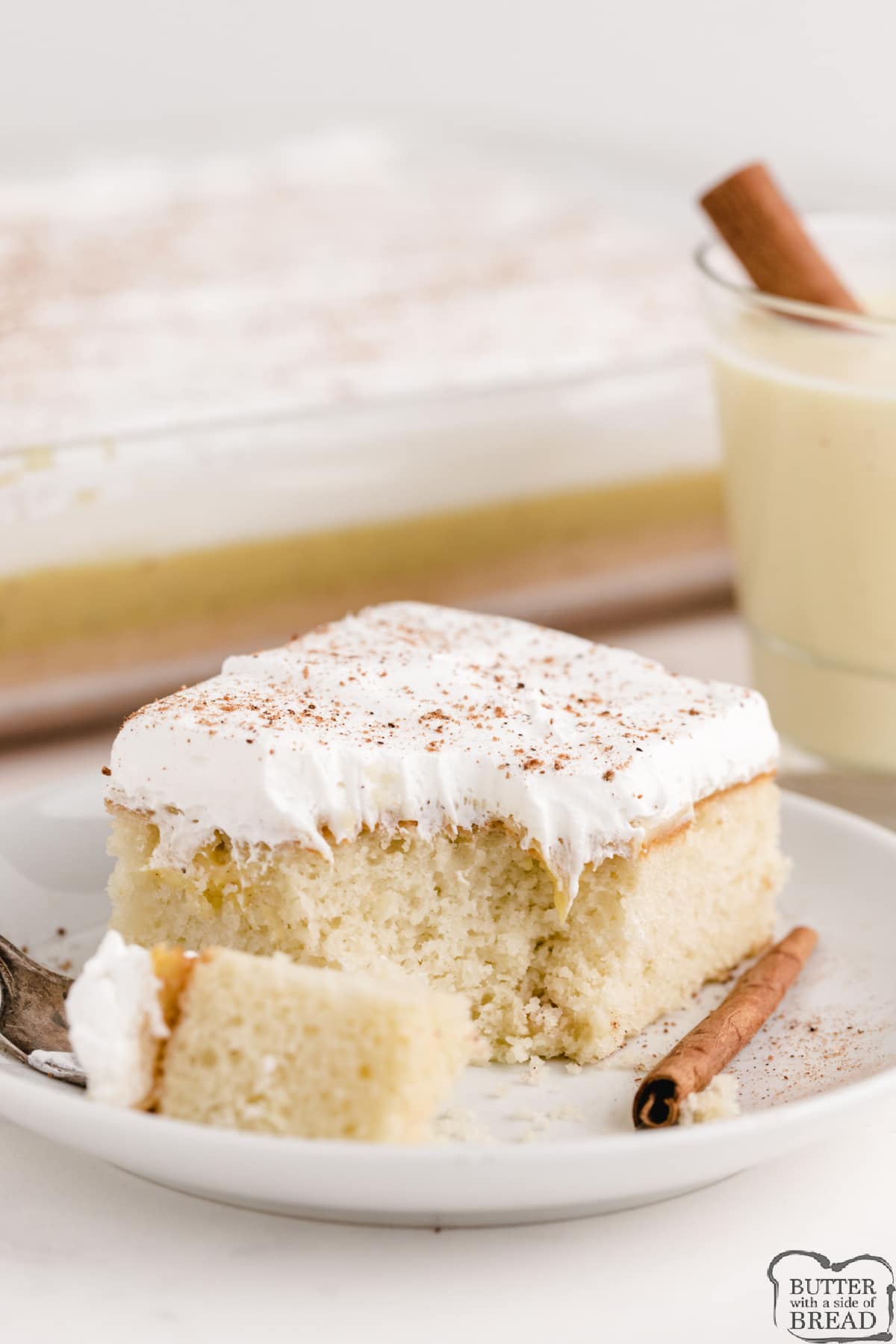 Poke cake recipe made with vanilla pudding and eggnog