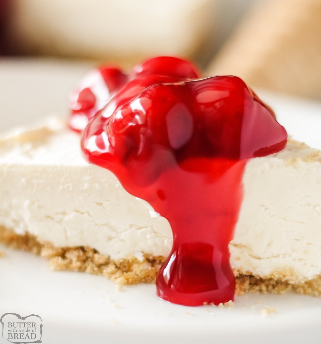 easy cheesecake ice cream pie topped with cherry pie filling