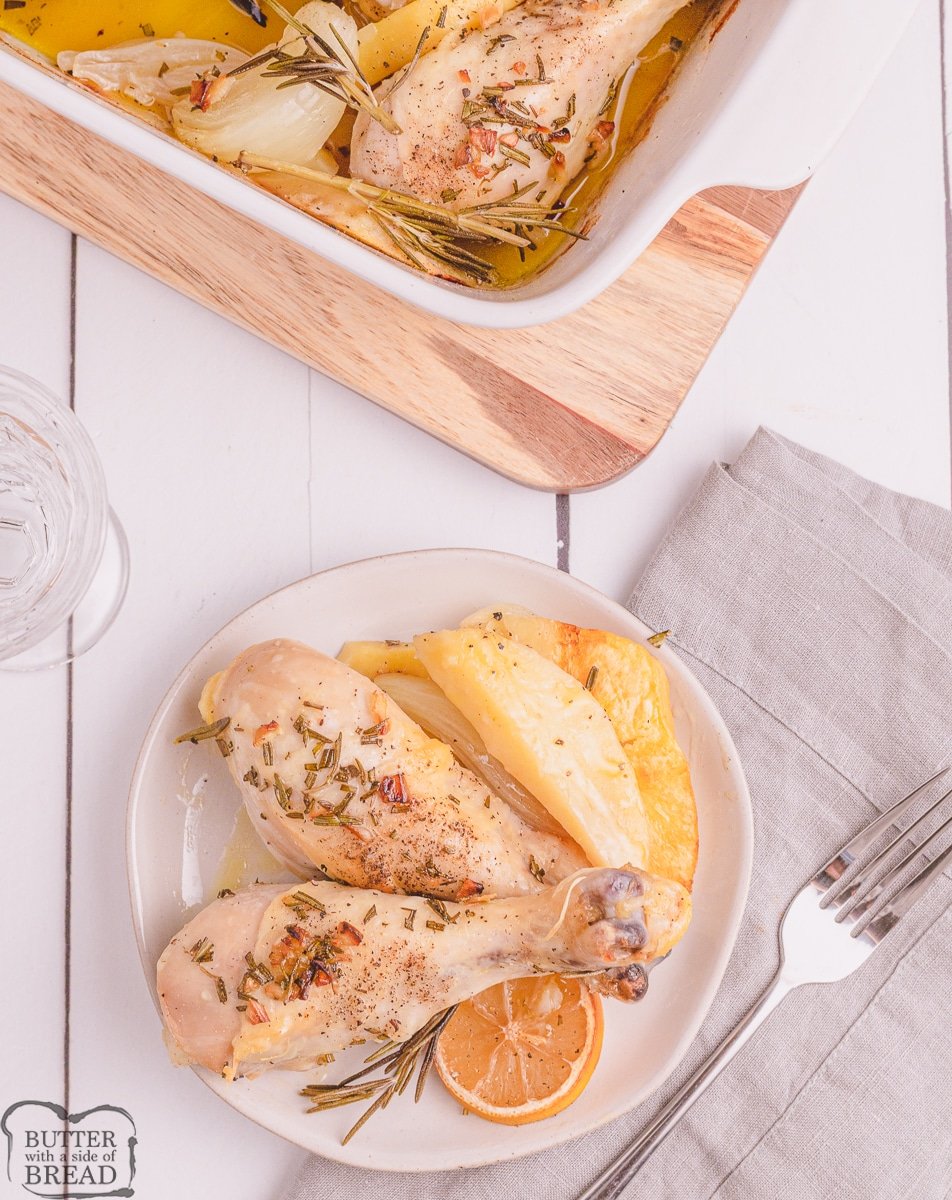 baked chicken drumsticks on a plate with potatoes