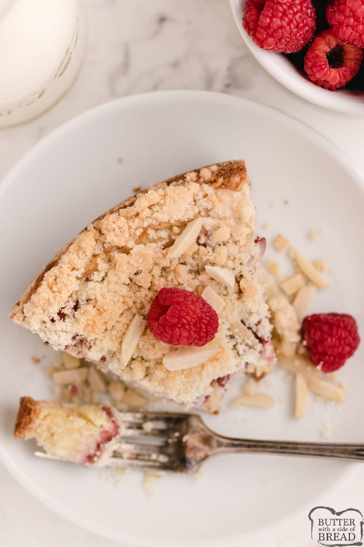 Raspberry Cream Cheese Coffee Cake is rich, moist and filled with sweetened cream cheese and a raspberry jam filling. Fantastic flavor in this simple breakfast cake recipe that everyone loves!