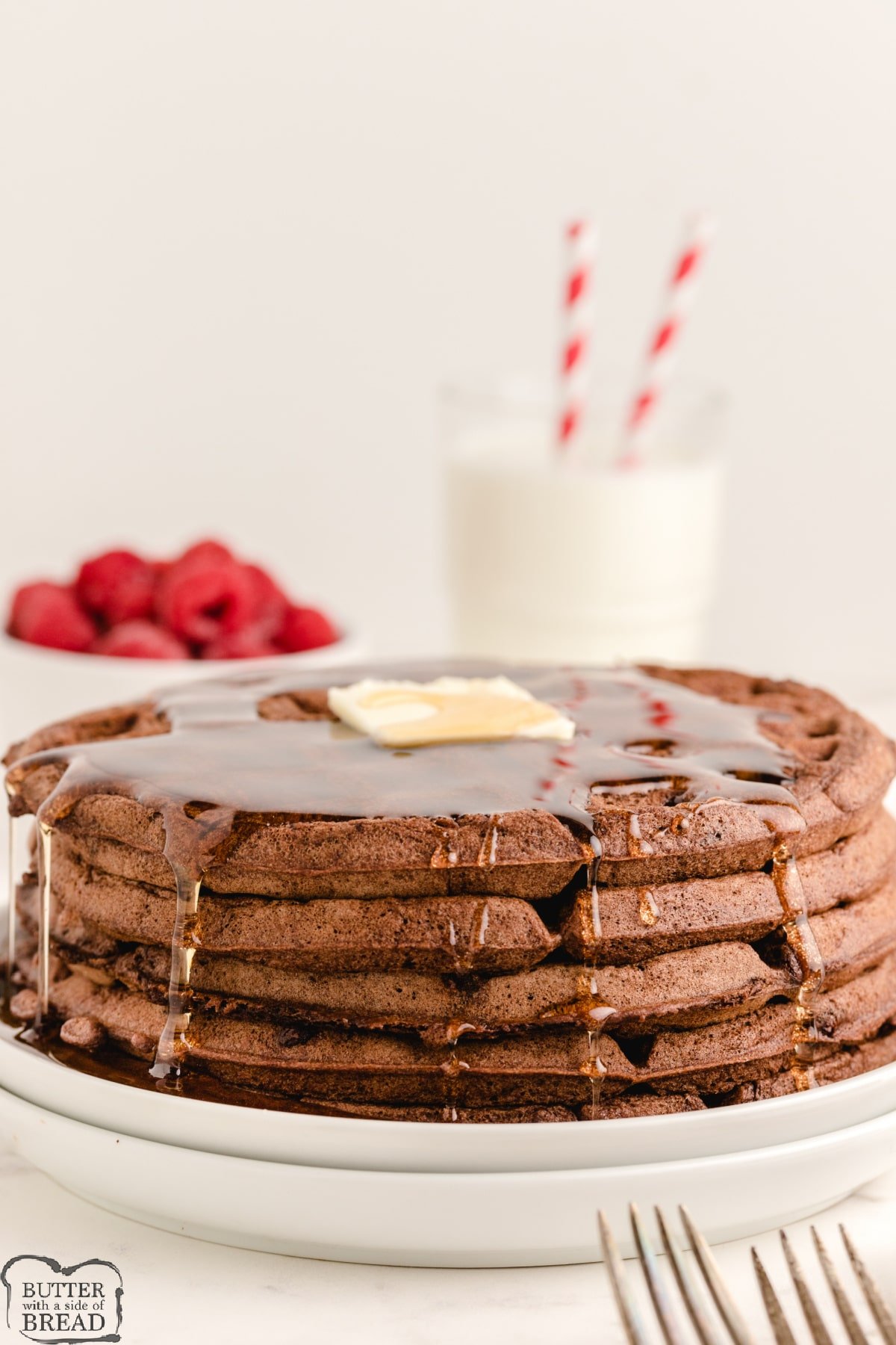 Stack of chocolate pancakes with syrup