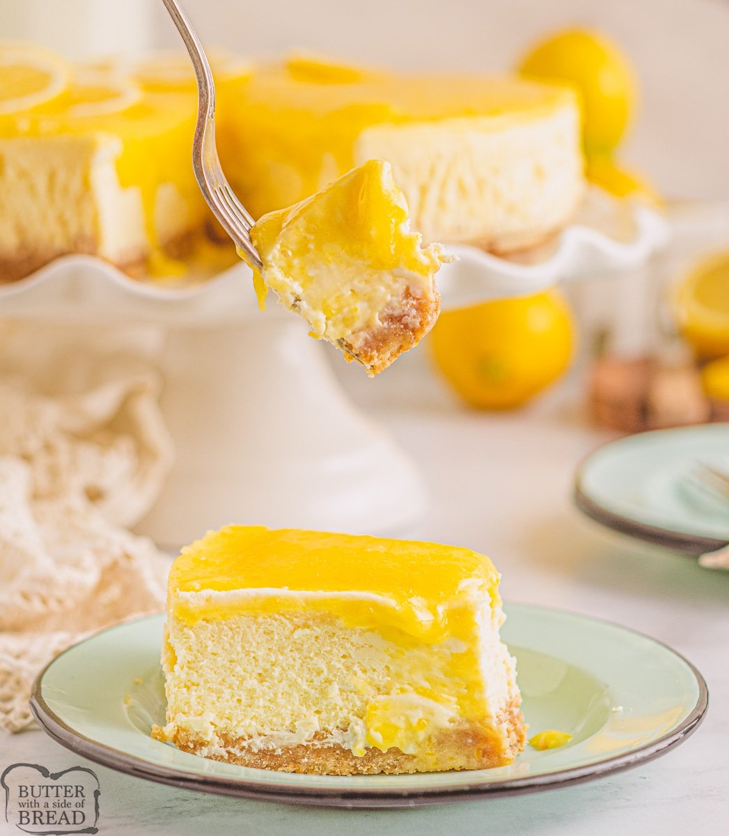 bite of lemon cheesecake topped with lemon curd