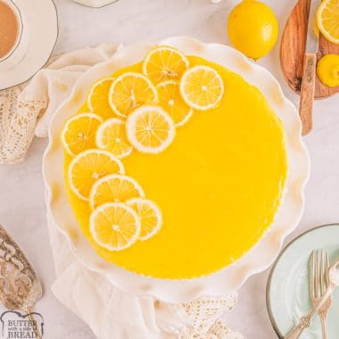 lemon bar cheesecake dessert with lemon slices on top