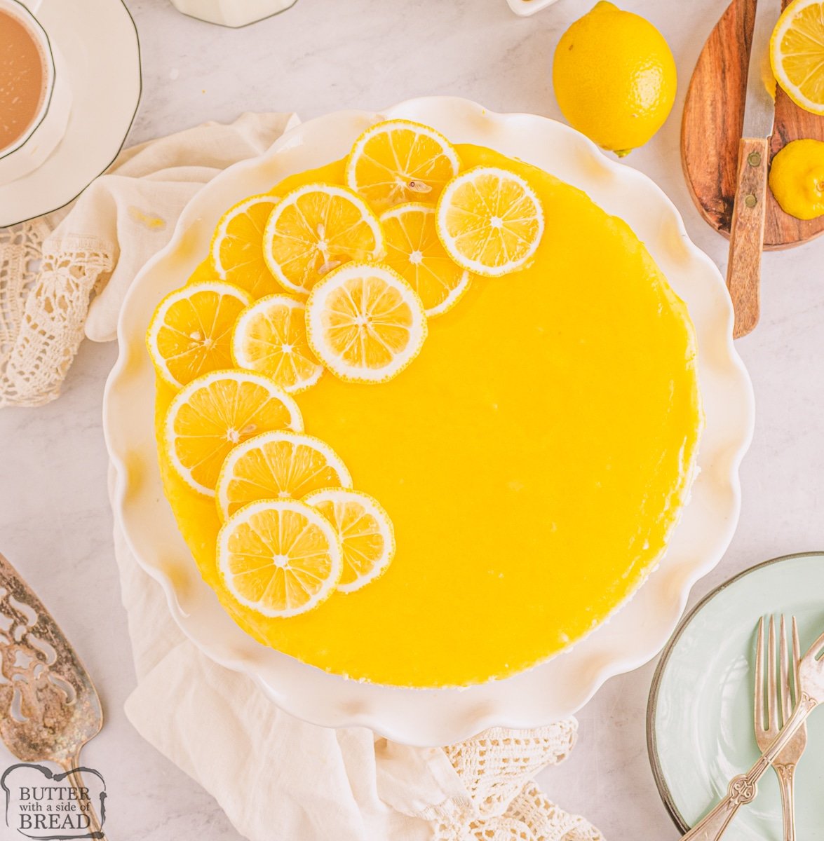 lemon bar cheesecake dessert with lemon slices on top