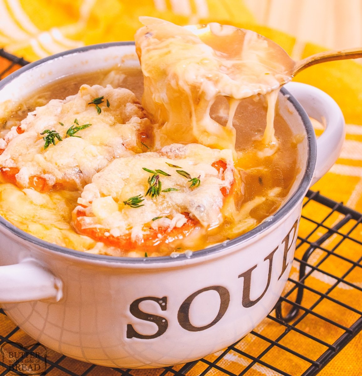 french onion soup in a soup bowl with cheese toasts on top