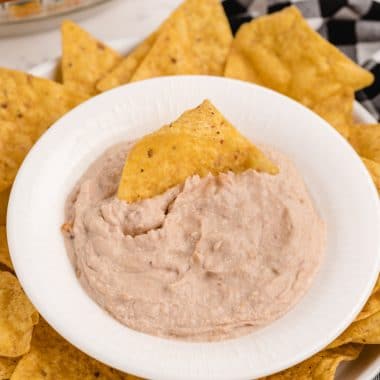 green chile bean dip in a white bowl