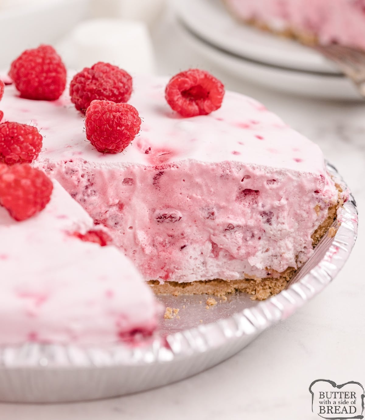 This easy No Bake Raspberry Marshmallow Pie comes together in minutes with just five simple ingredients for a light, creamy, fruity dessert!
