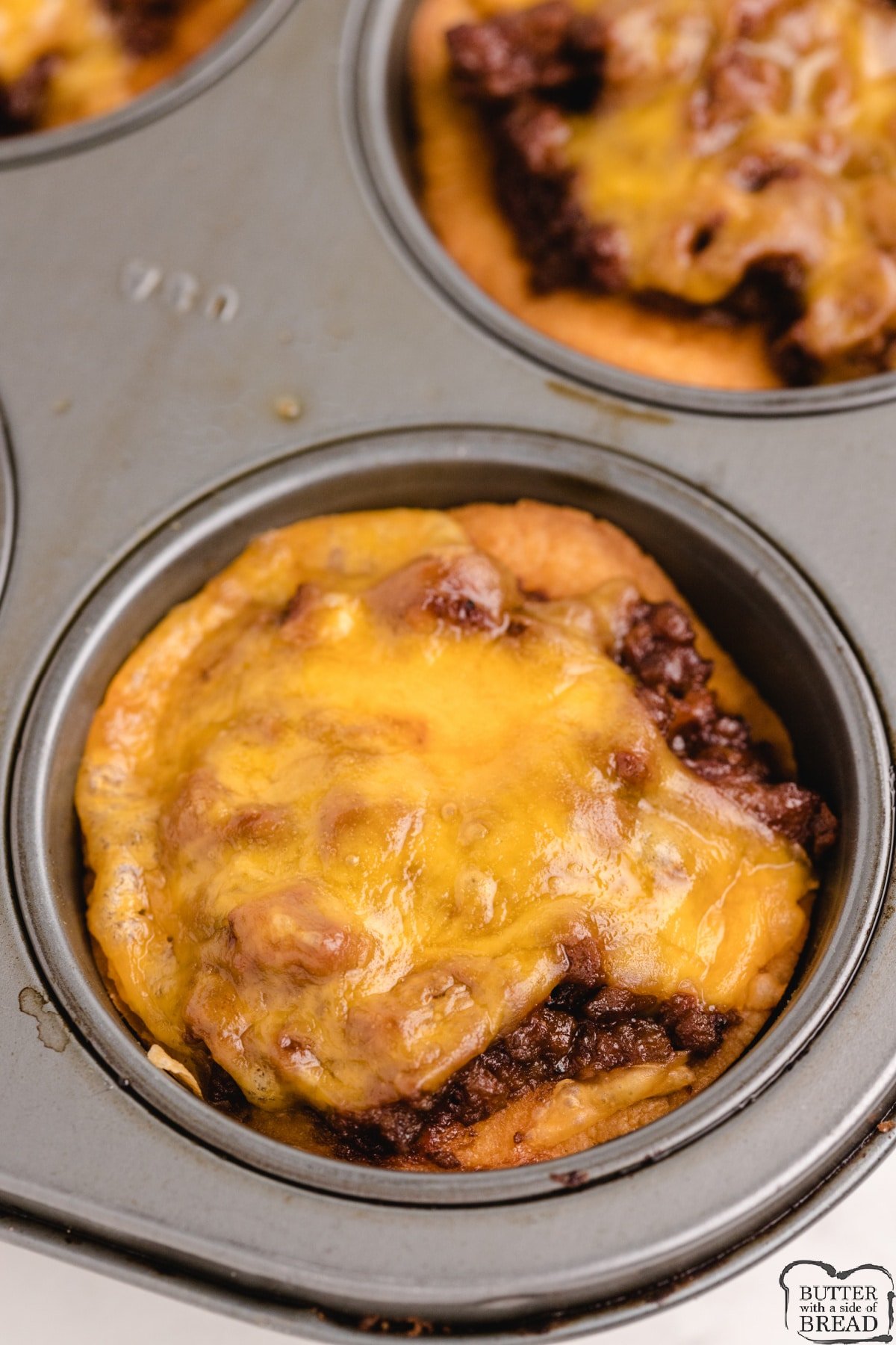 Biscuit cups filled with BBQ beef and cheddar cheese