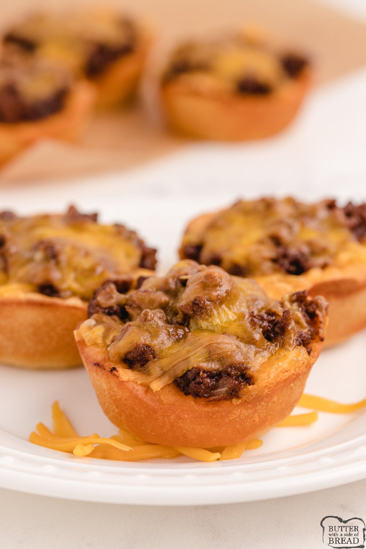 BBQ Beef Biscuit Cups made with cheese, biscuits and ground beef. Only a few simple ingredients to make these as a delicious appetizer recipe or an easy dinner!