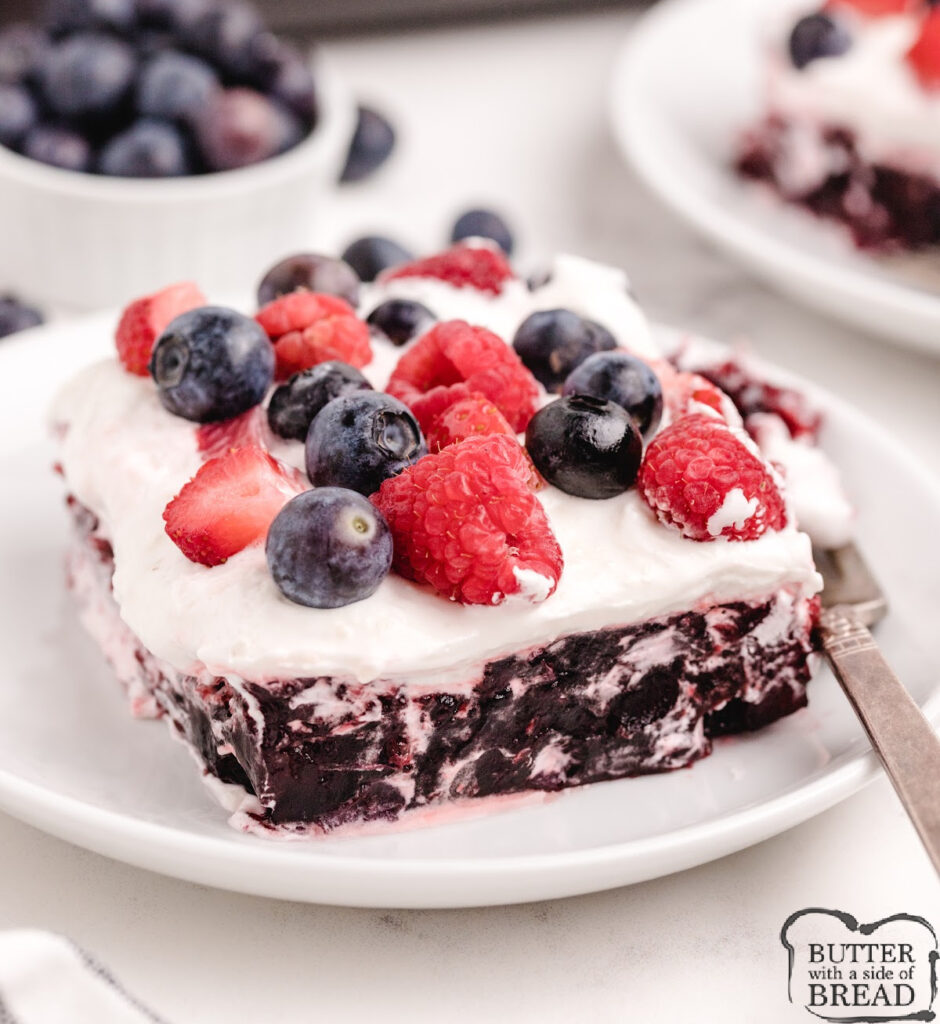 Blueberry Jello Salad is a quick and easy layered dessert made with berry gelatin, blueberry pie filling, and a fluffy cream topping. Perfect for holidays, potlucks, and summer gatherings!