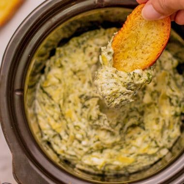 cheesy artichoke spinach dip in the slow cooker
