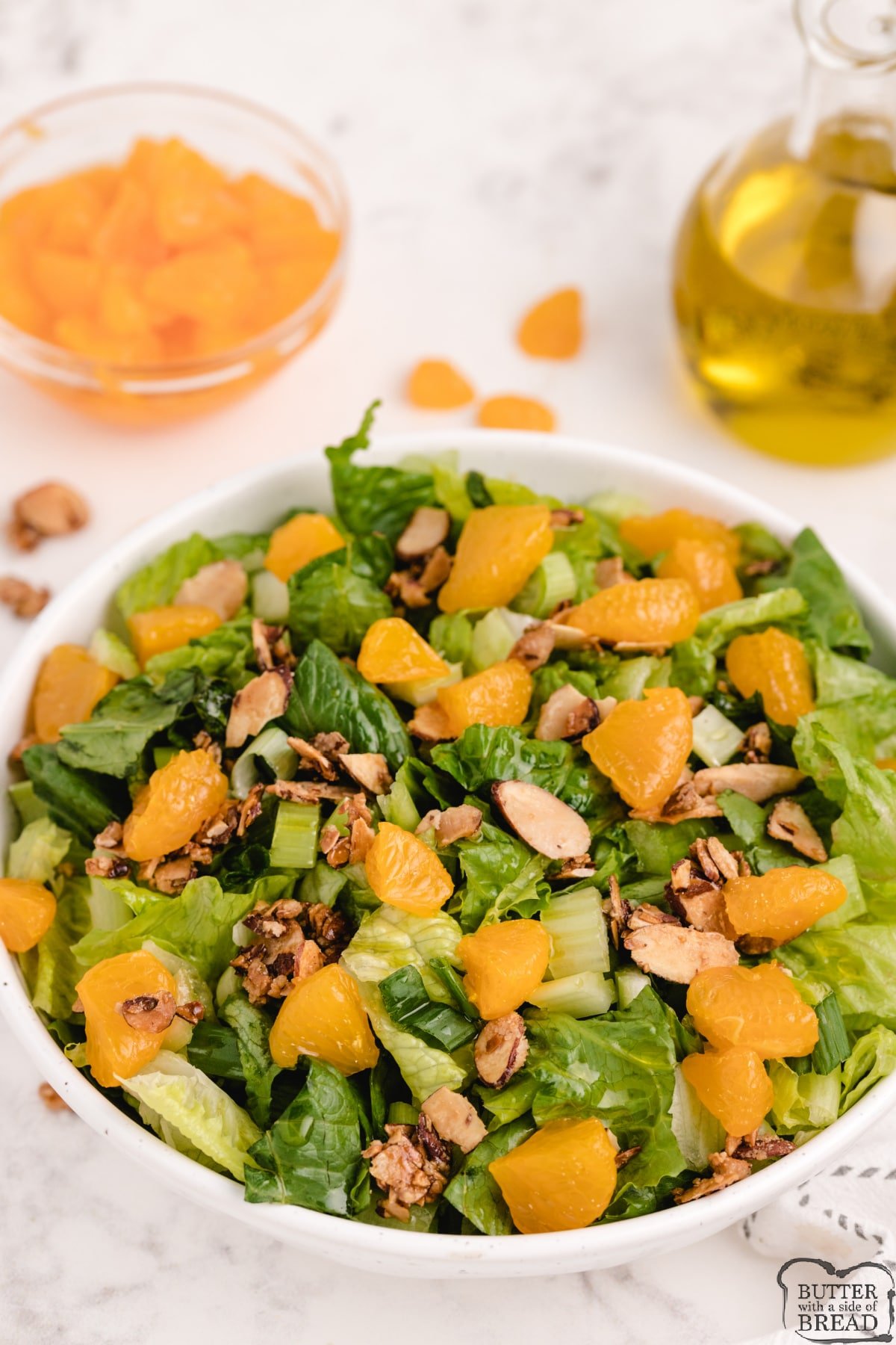 Salad made with mandarin oranges, sliced almonds and simple, sweet homemade dressing