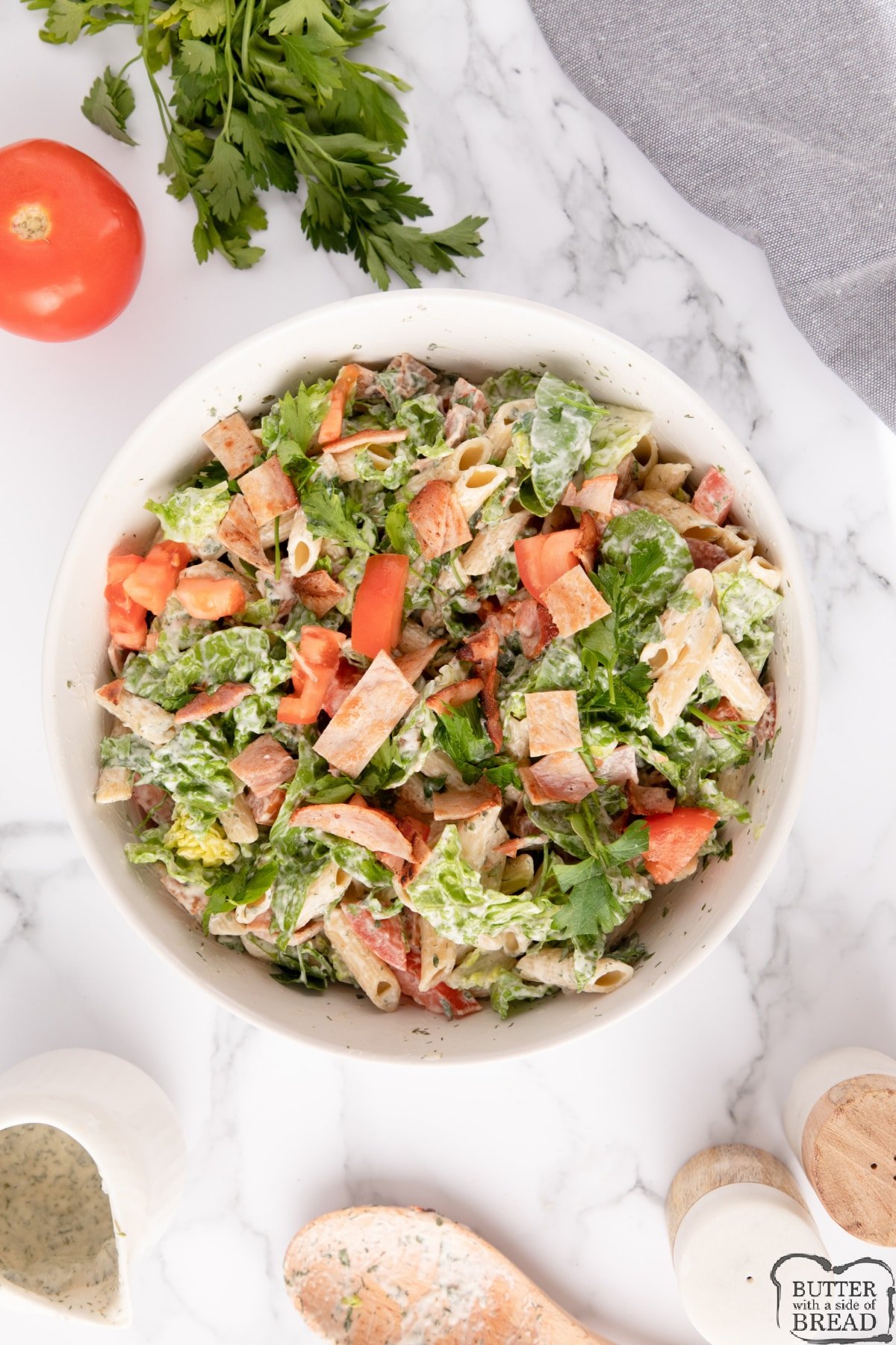 Pasta salad with bacon, lettuce and tomatoes in a creamy ranch dressing