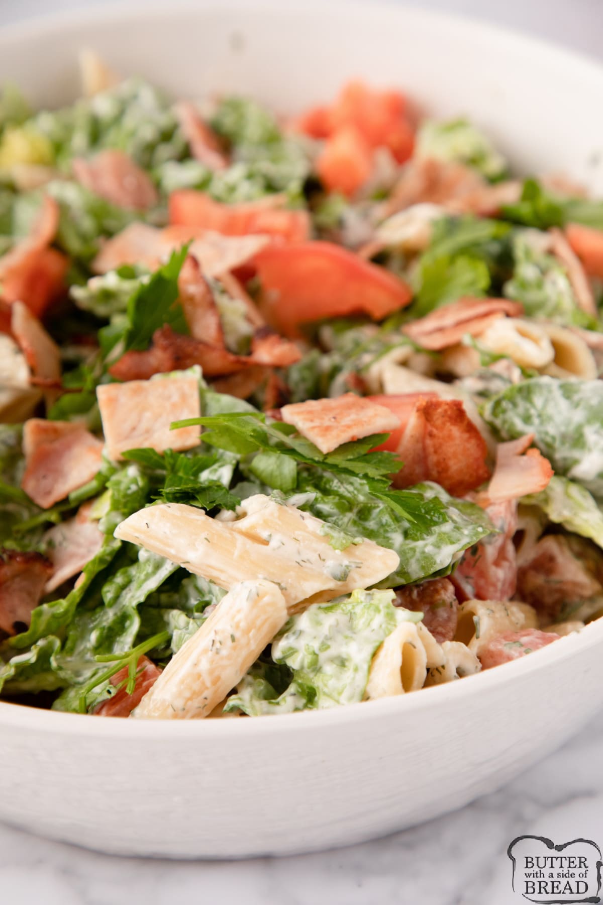 BLT Pasta Salad is full of bacon, lettuce and tomatoes that are coated with a creamy, homemade ranch dressing. Simple pasta salad recipe perfect for a meal or a side dish everyone will love! 