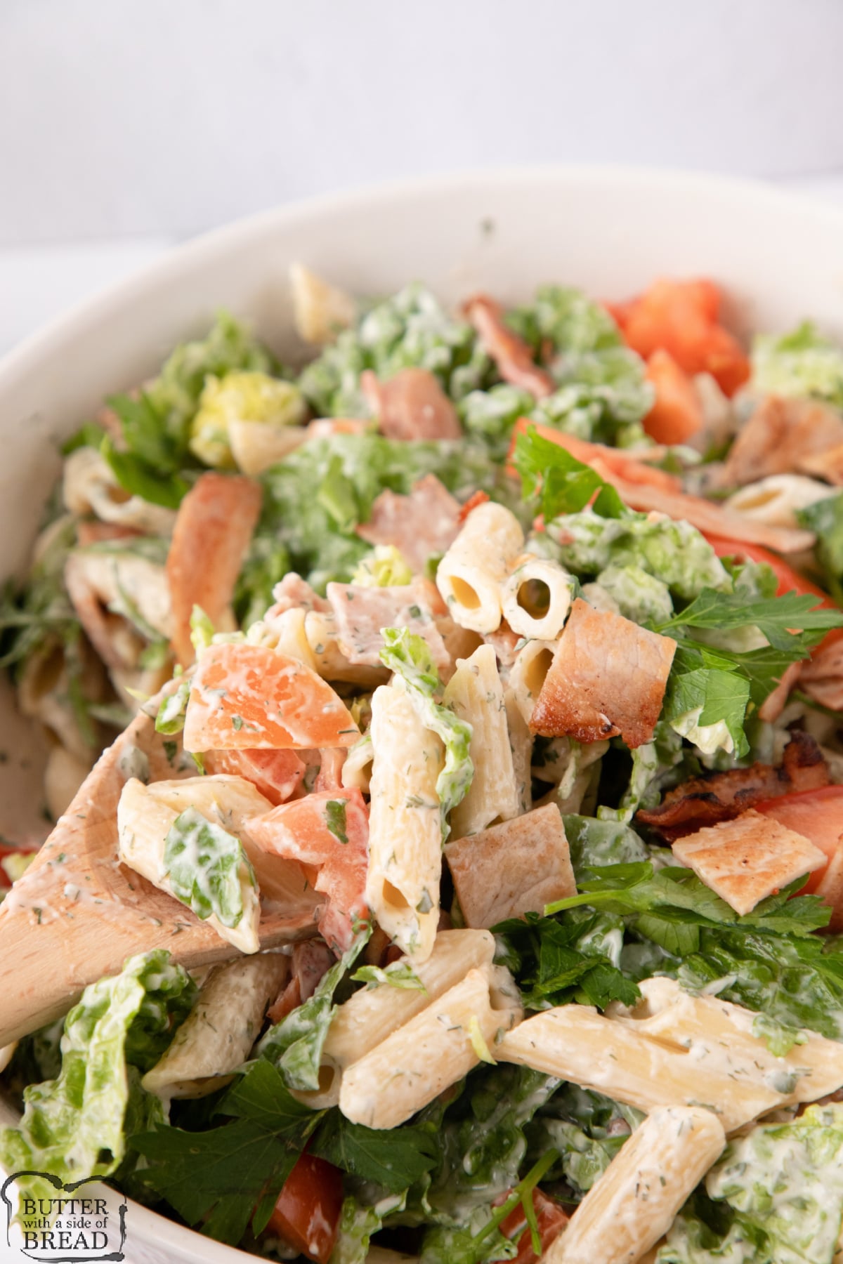 Pasta salad recipe with homemade ranch, lettuce, bacon and tomatoes
