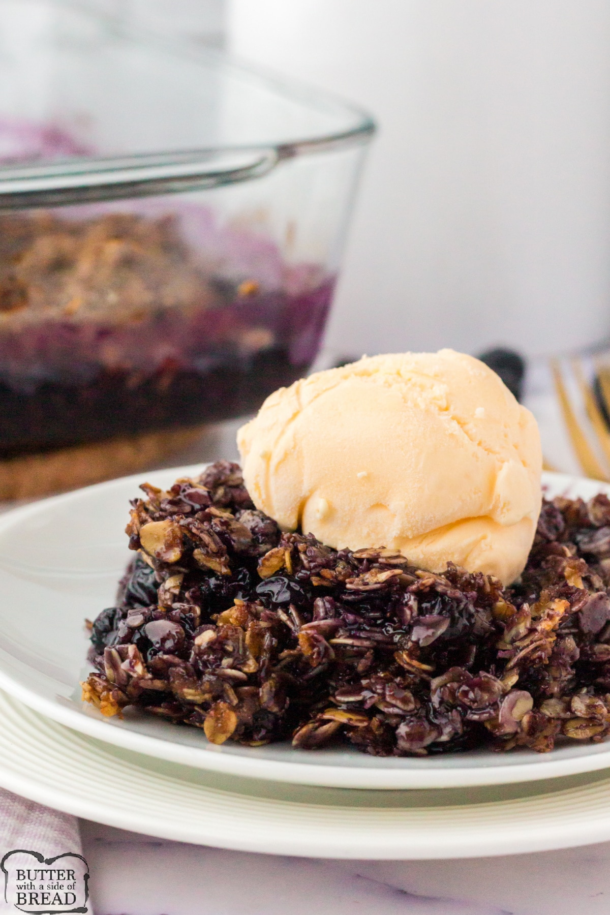 Blueberry crumble with ice cream on top
