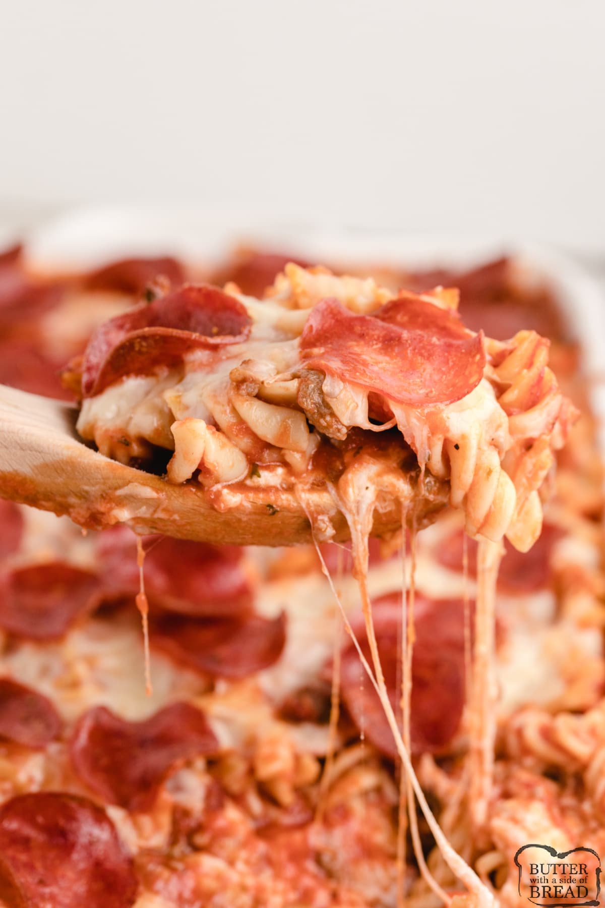 Baked pasta with cheese, spaghetti sauce and pizza toppings