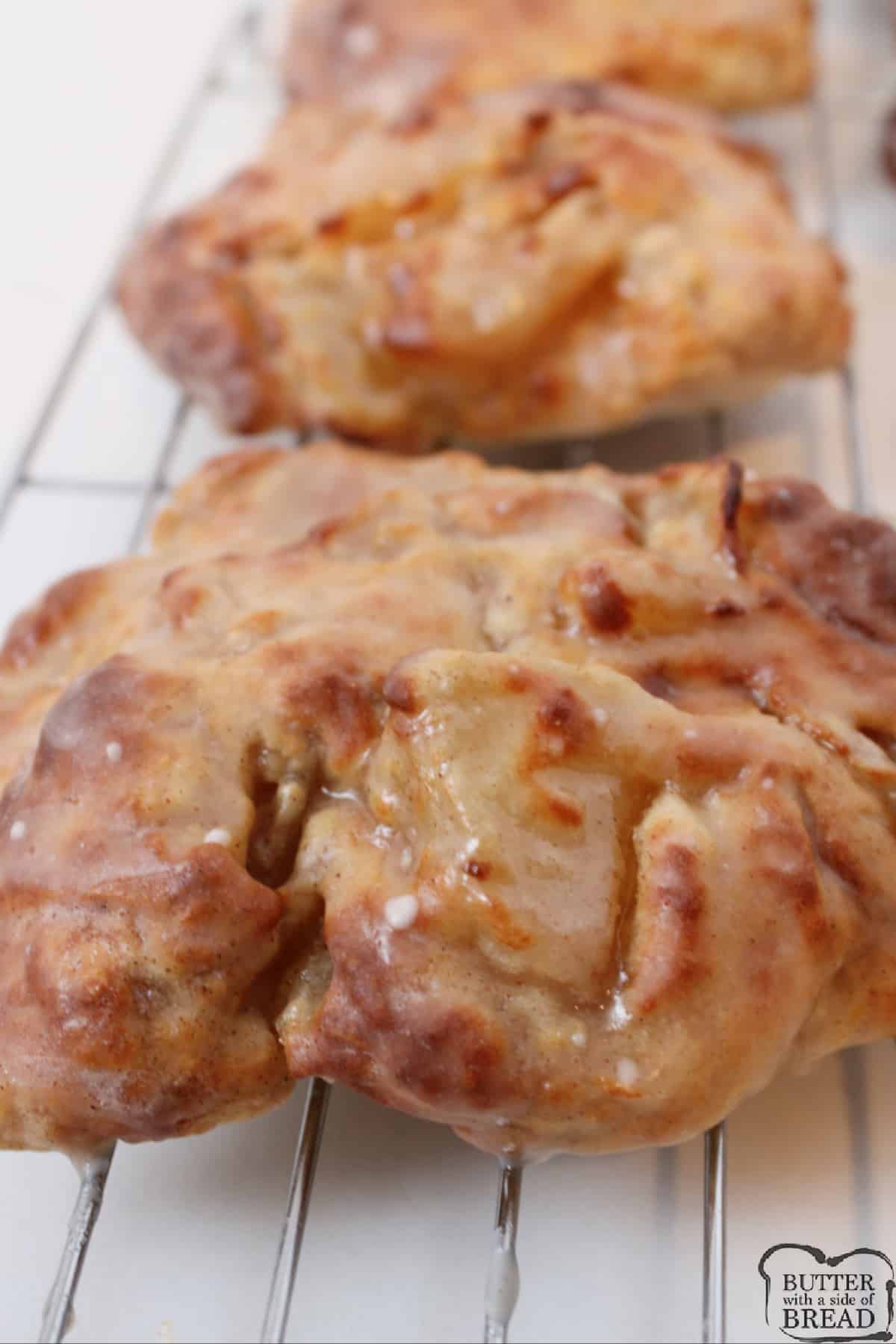 Air Fryer Apple Fritters dipped in cinnamon glaze