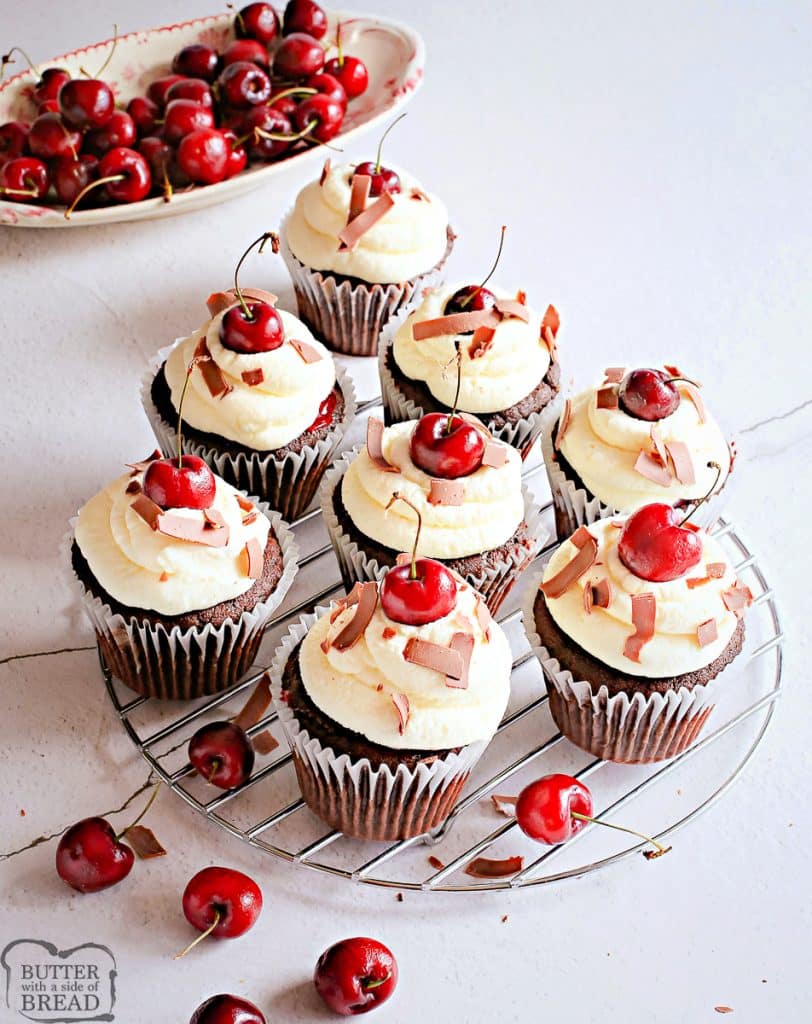 cherry cupcakes topped with chocolate and sweet cream