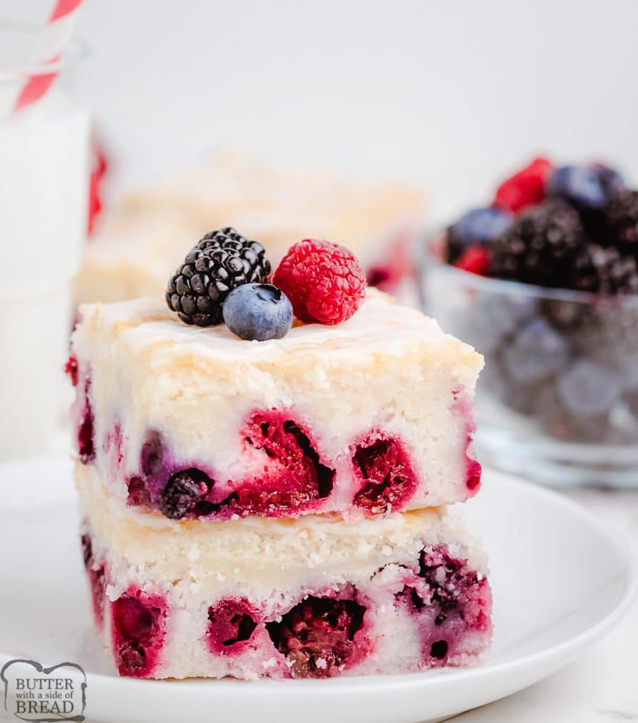 stacked squares of cake with berries