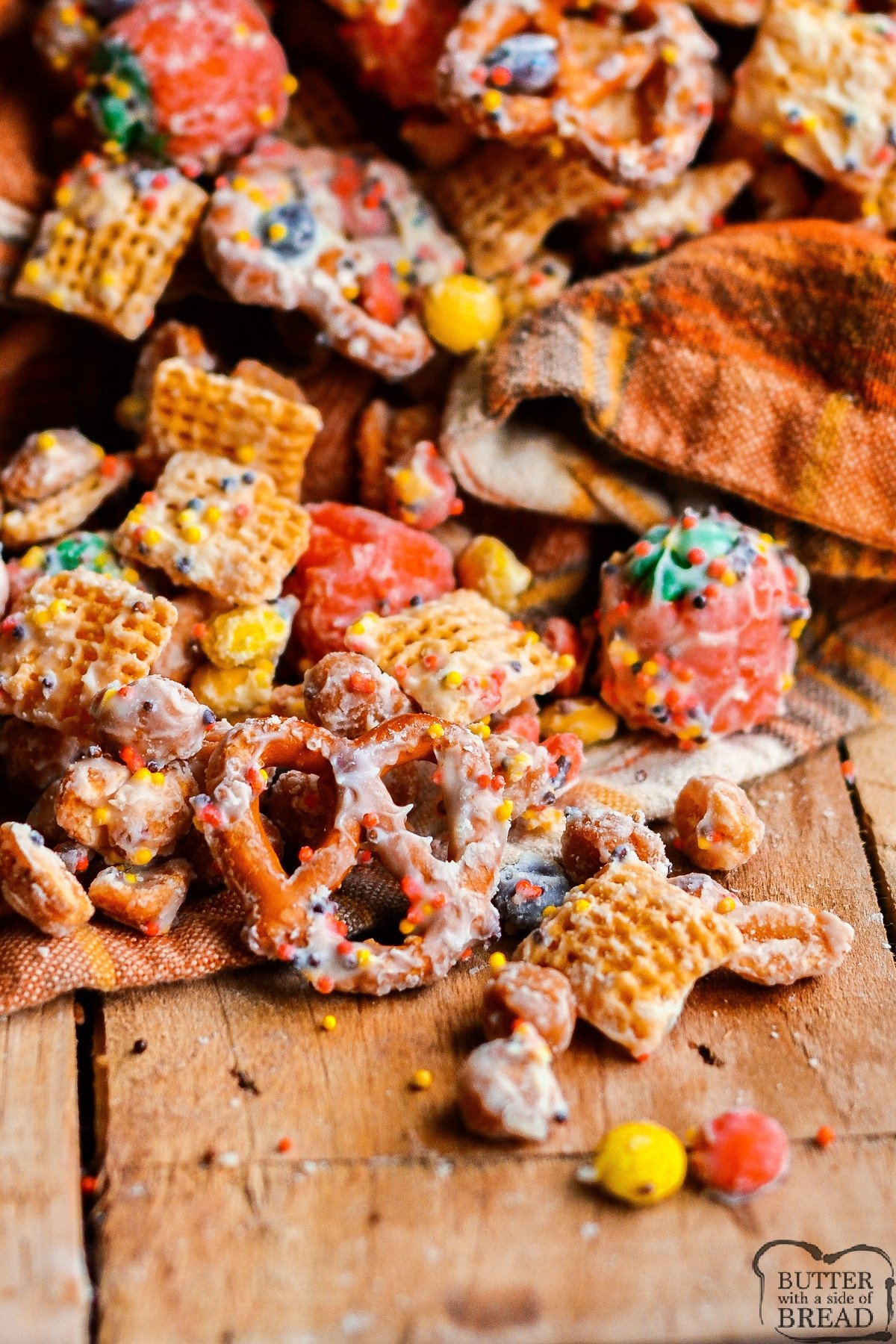 Fall White Chocolate Chex Mix is made with cereal, pretzels, peanuts, and M&Ms all coated in white chocolate. This easy white chocolate chex mix recipe is salty and sweet and comes together in less than 5 minutes!