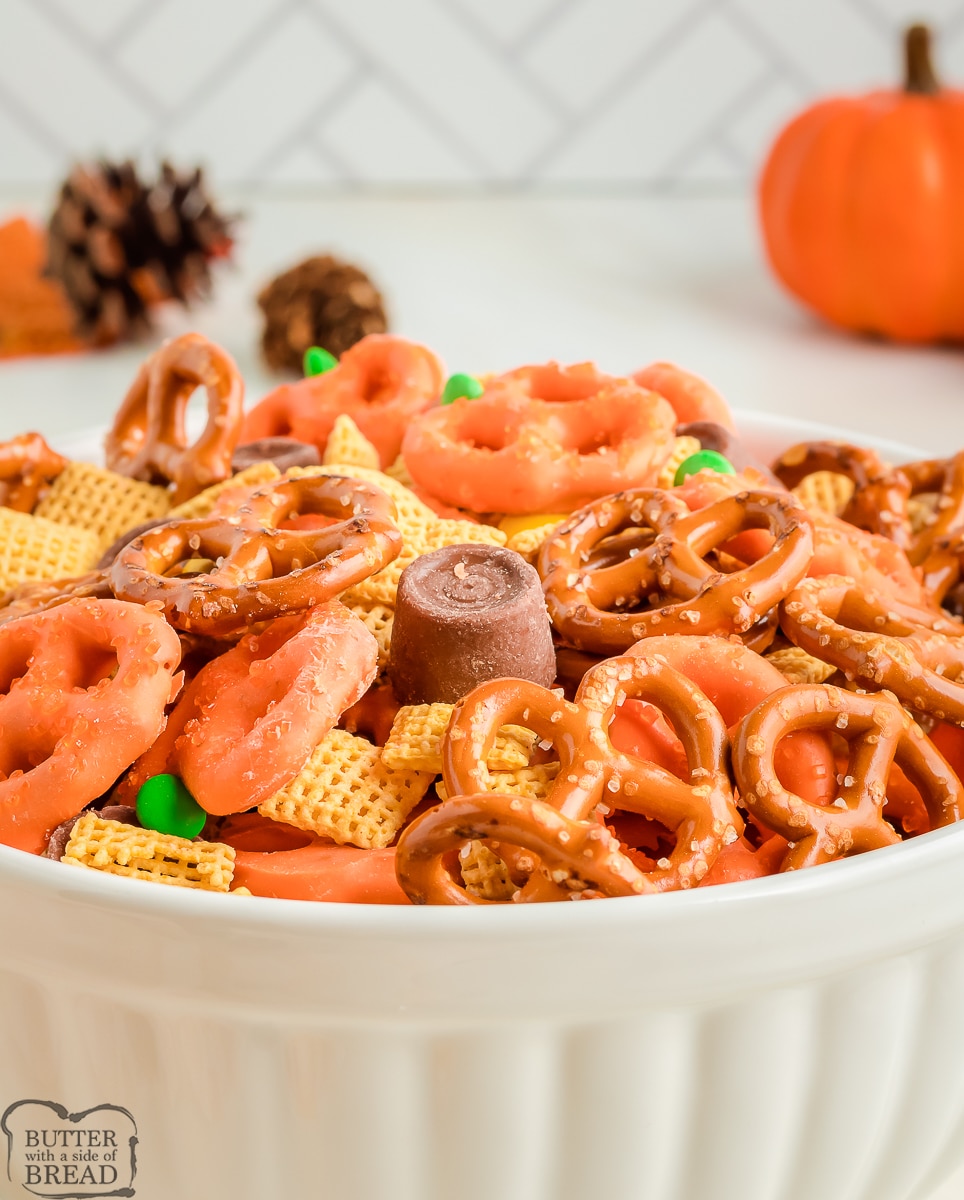 bowl filled with festive pumpkin snack mix