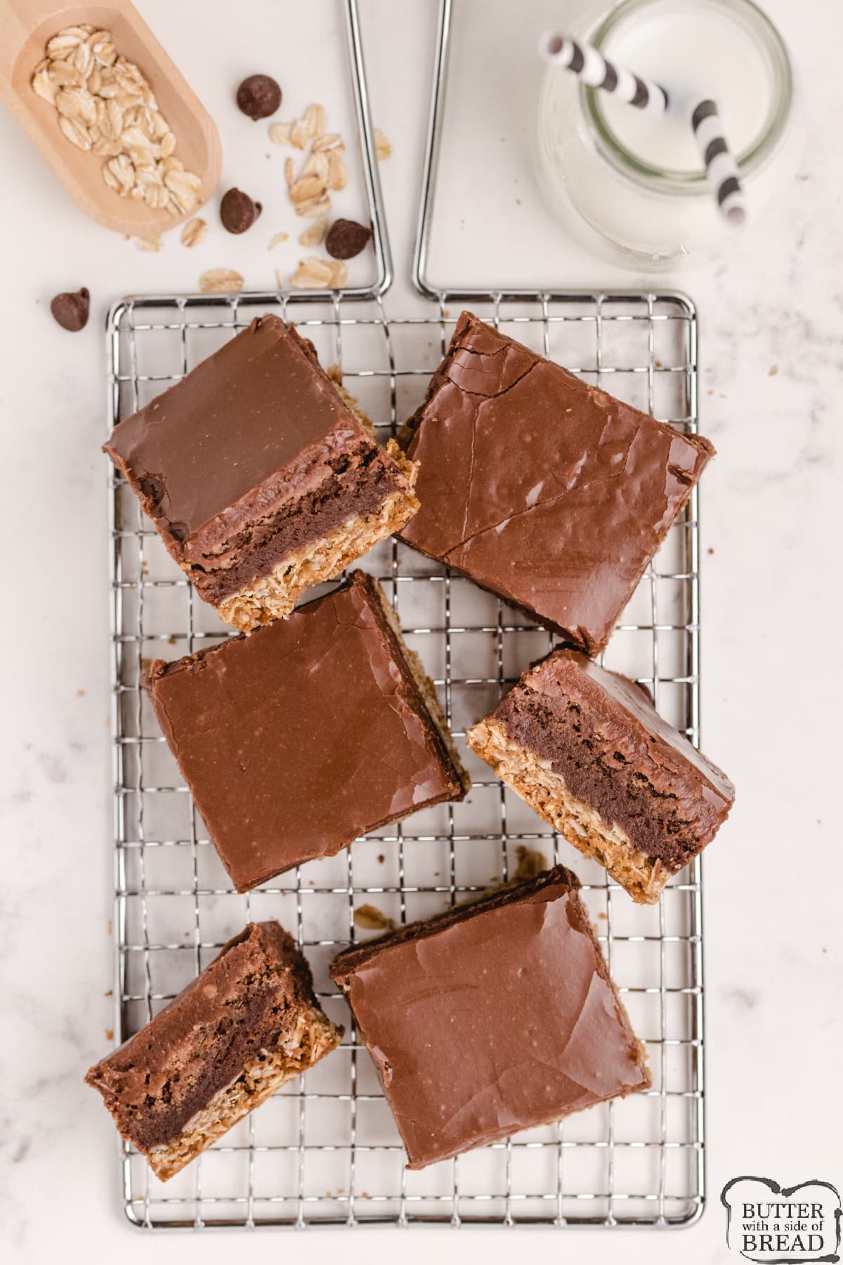 Oatmeal Cookie Brownie Bars made completely from scratch with three different layers. There is an oatmeal crust, a brownie layer and a simple chocolate frosting on top! 
