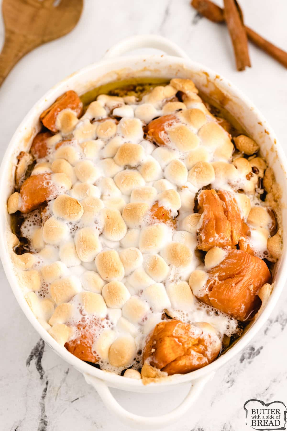 Apple Sweet Potato Casserole with Marshmallows made with sliced apples and canned sweet potatoes along with butter, brown sugar, cinnamon, pecans and marshmallows. Delicious sweet potato recipe that is perfect for Thanksgiving dinner.