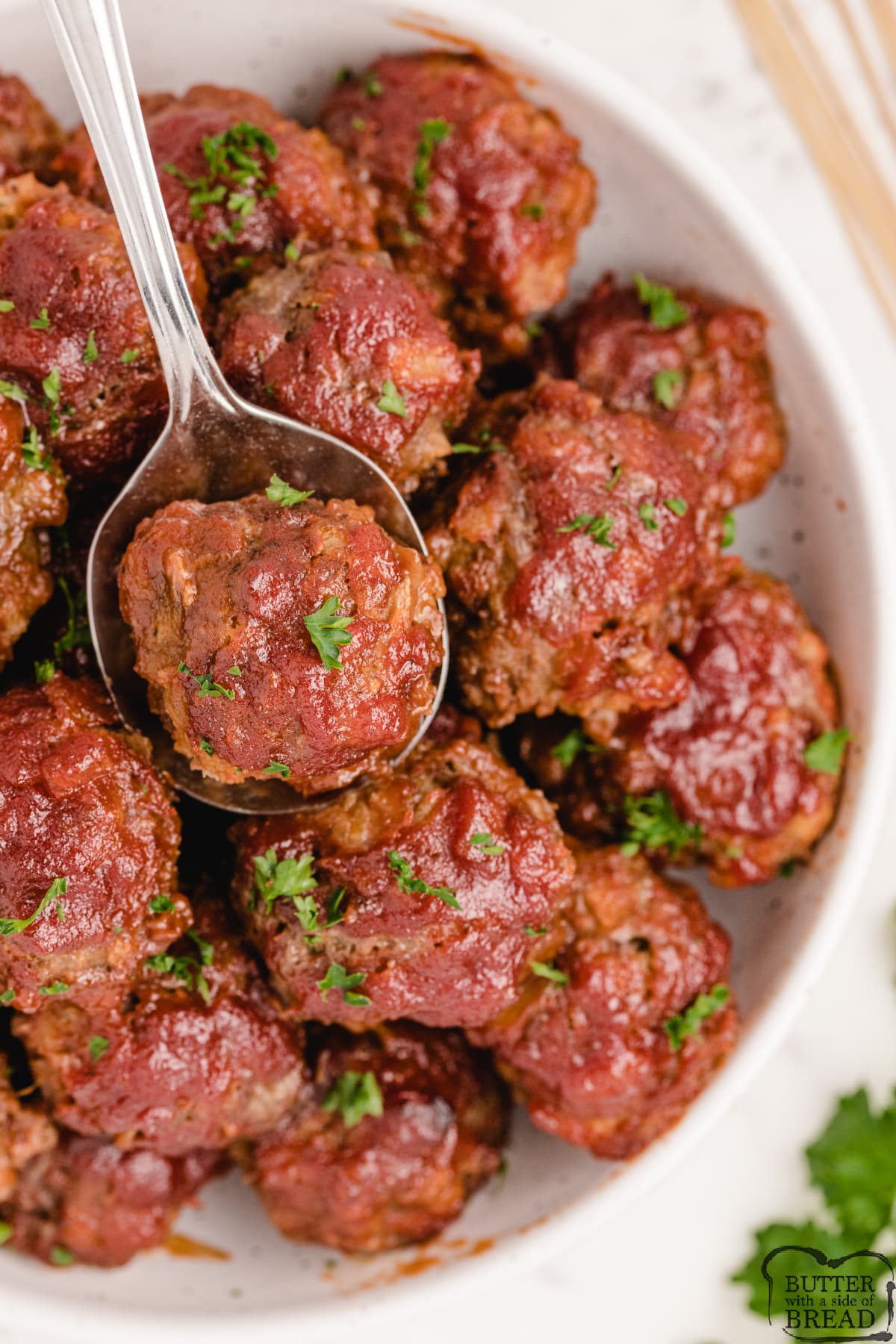 BBQ Meatballs made with ground beef, pork sausage and a delicious homemade barbecue sauce. These meatballs are perfect as an appetizer or serve them over rice for an easy dinner!