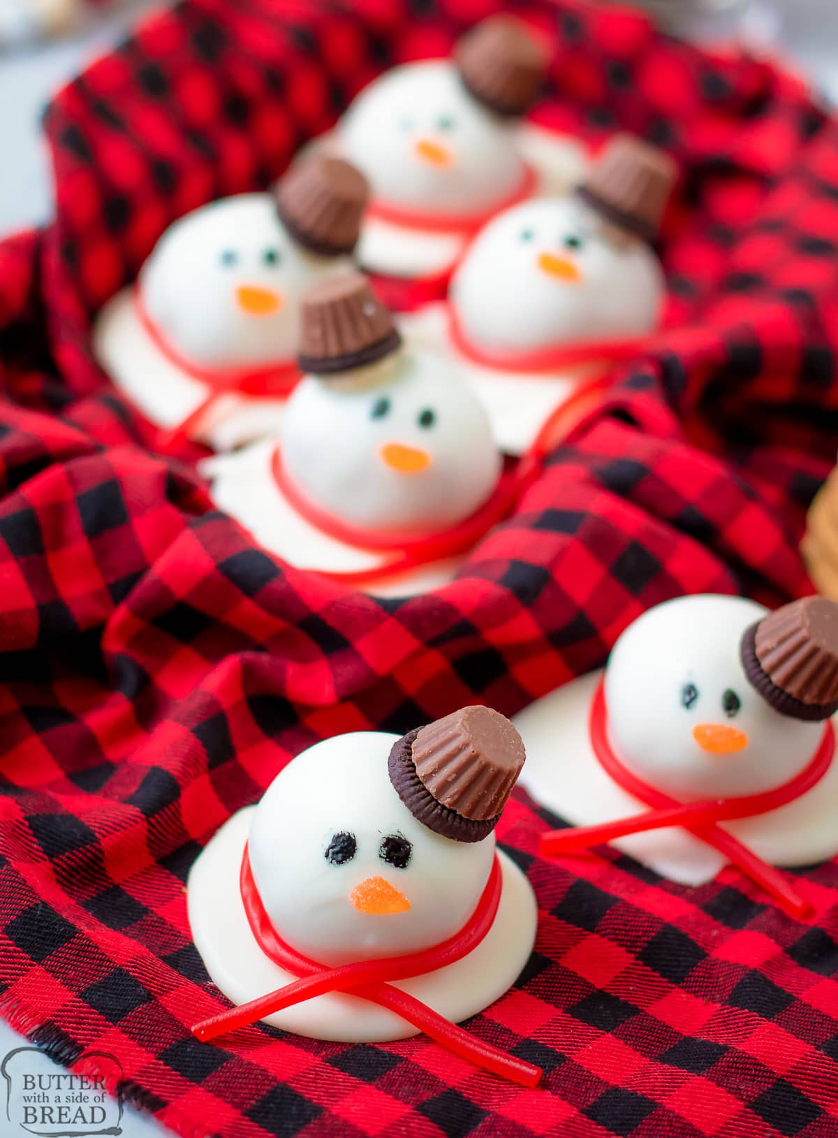 snowman truffles on a red checkered cloth
