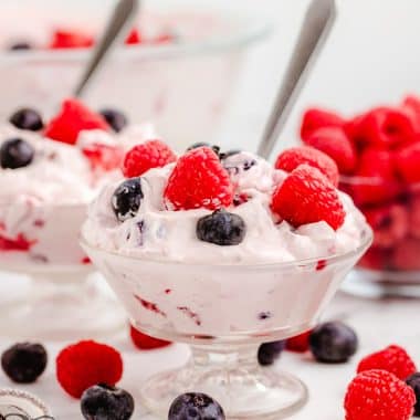 berries and cream salad with a spoon