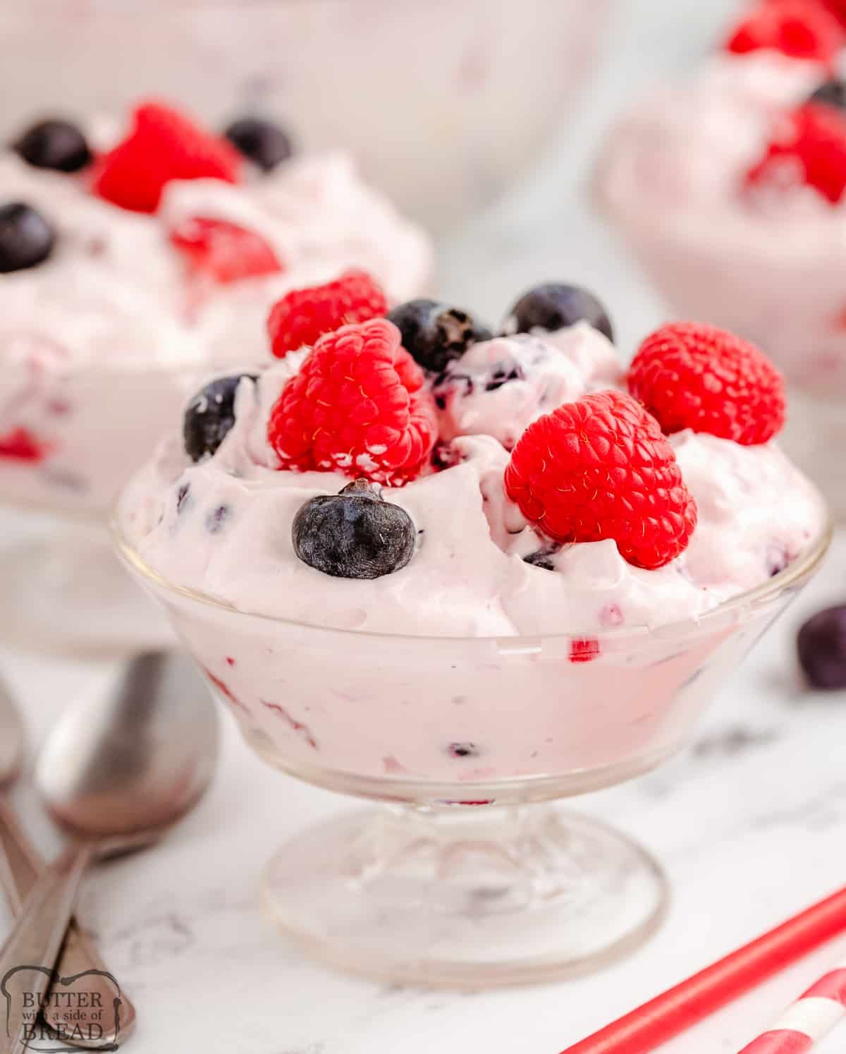 berries and cream in a parfait glass