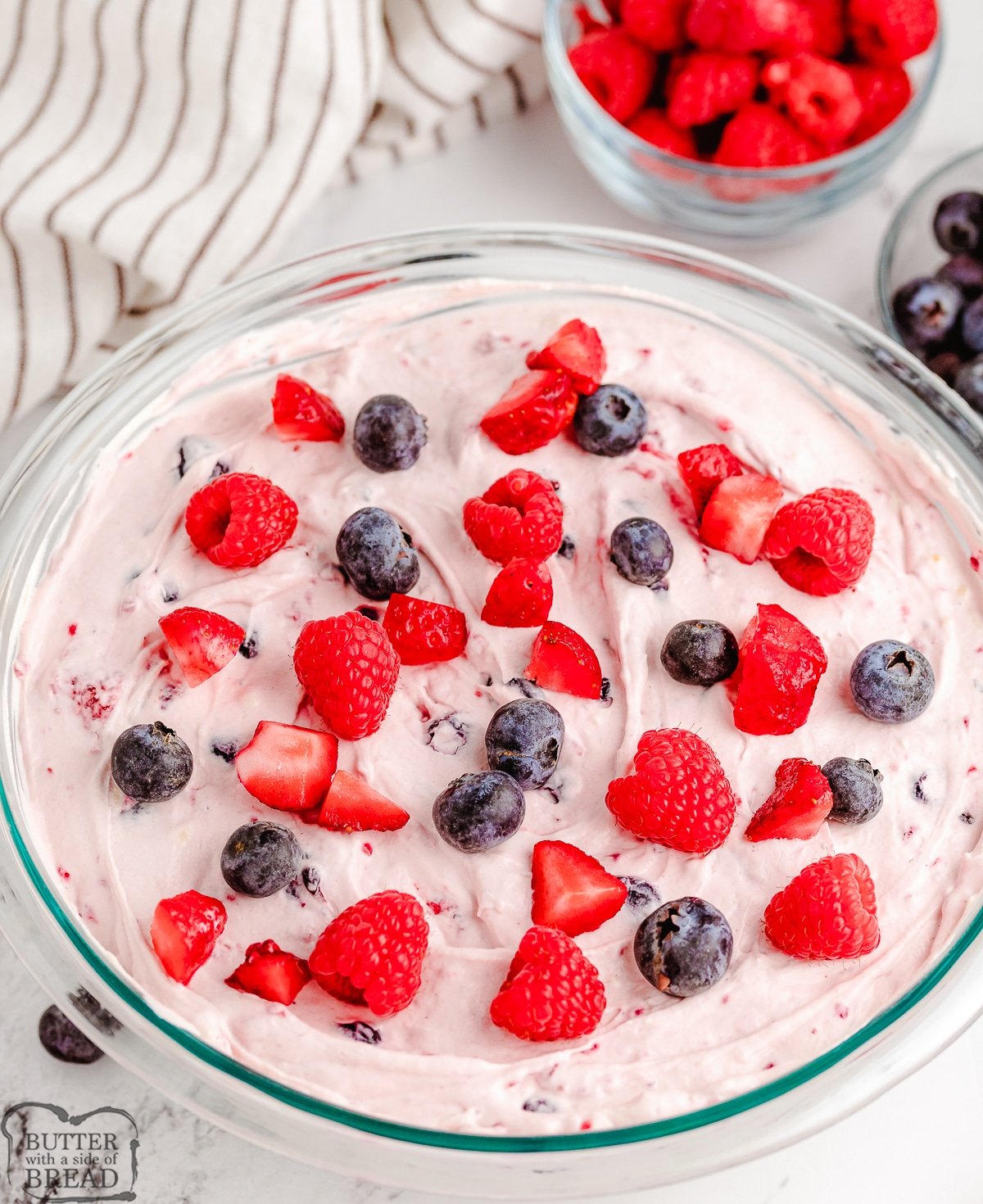 bowl of berries and cream fluff salad