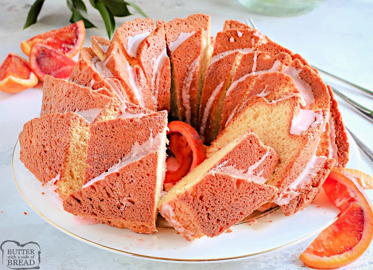orange bundt cake with some slices cut