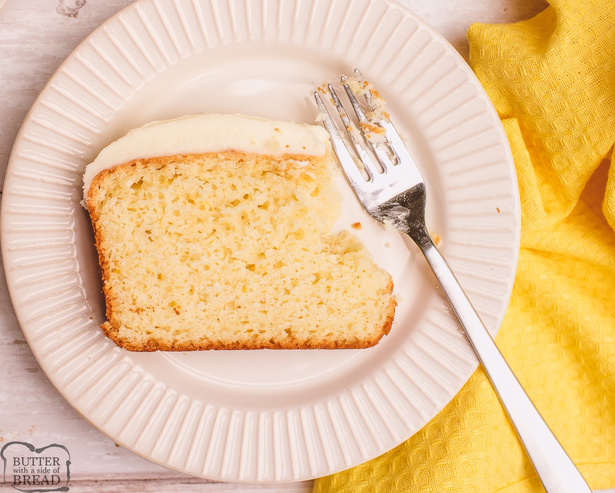 slice of lemon cake with a bite on a fork