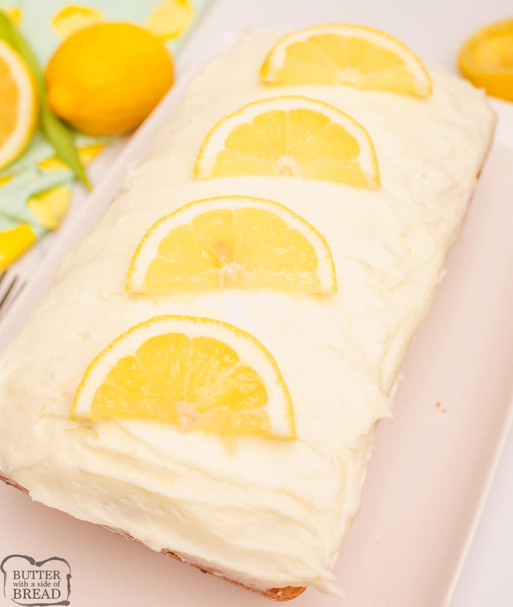 lemon loaf cake with sliced lemons on top