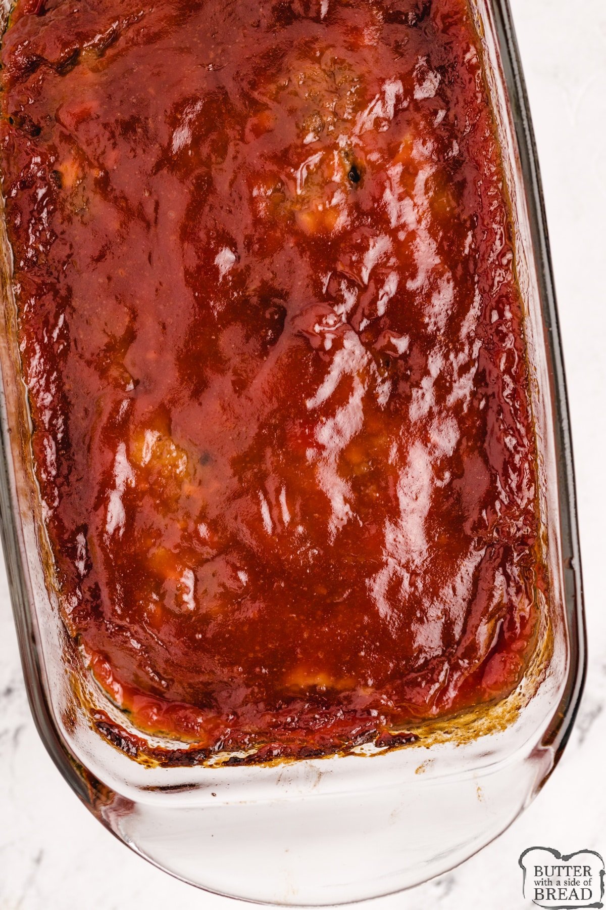 Easy meatloaf recipe made with crackers and a simple sauce on top