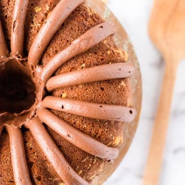 peanut butter banana bundt cake with thick lines of frosting