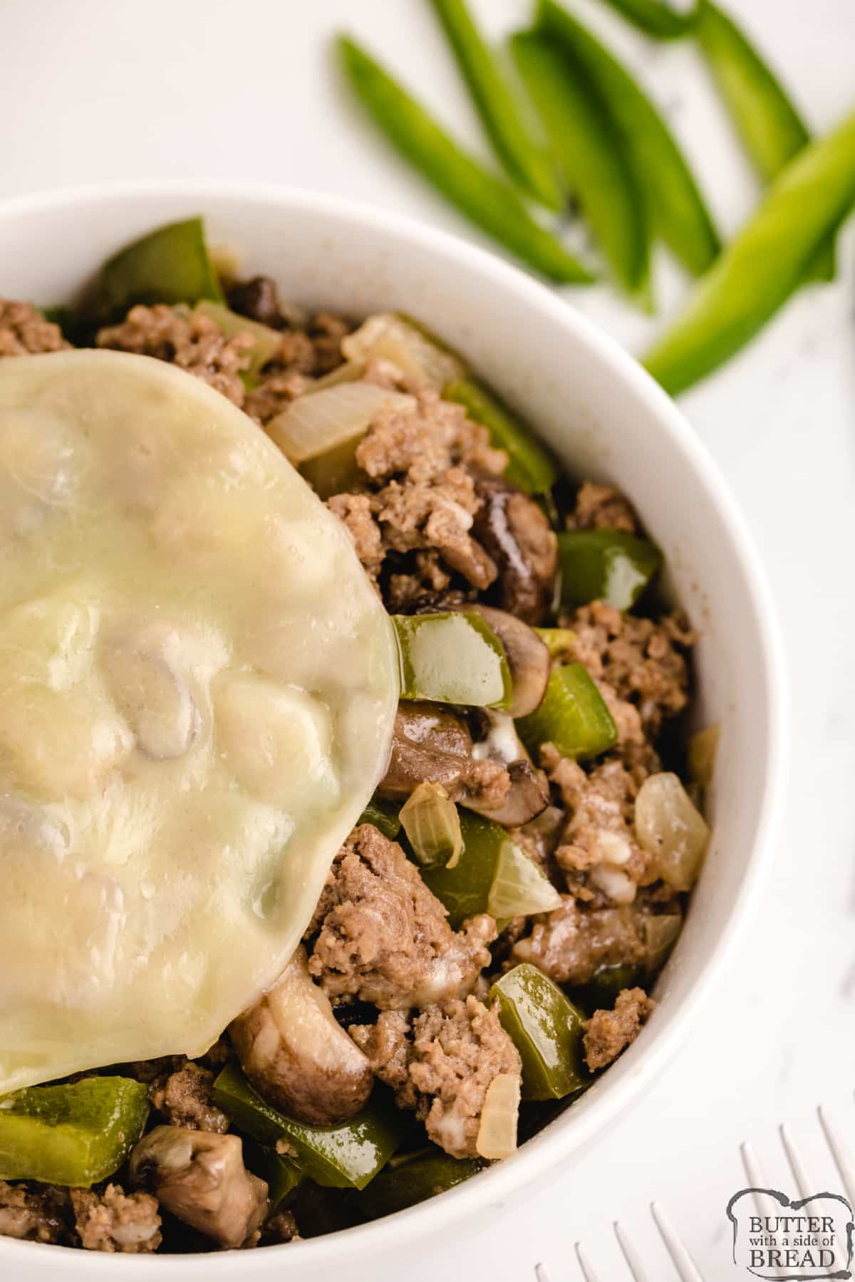 Philly Cheesesteak Bowls made with ground beef, peppers, mushrooms and onions
