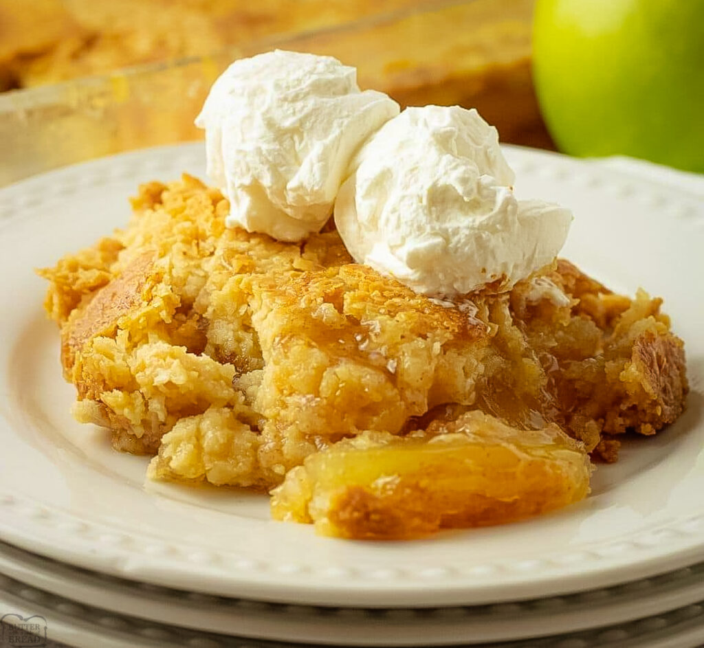 buttery apple dump cake with a scoop of vanilla ice cream on top