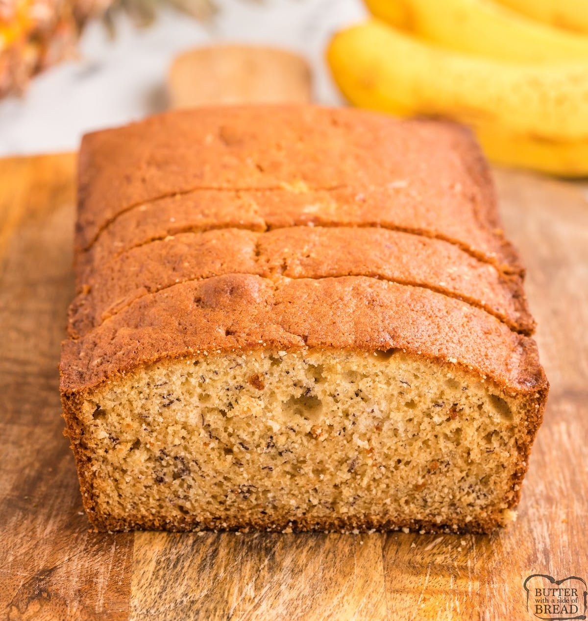 Pineapple Banana Bread made with ripe bananas and crushed pineapple! The pineapple adds moisture and flavor to this delicious banana bread recipe.