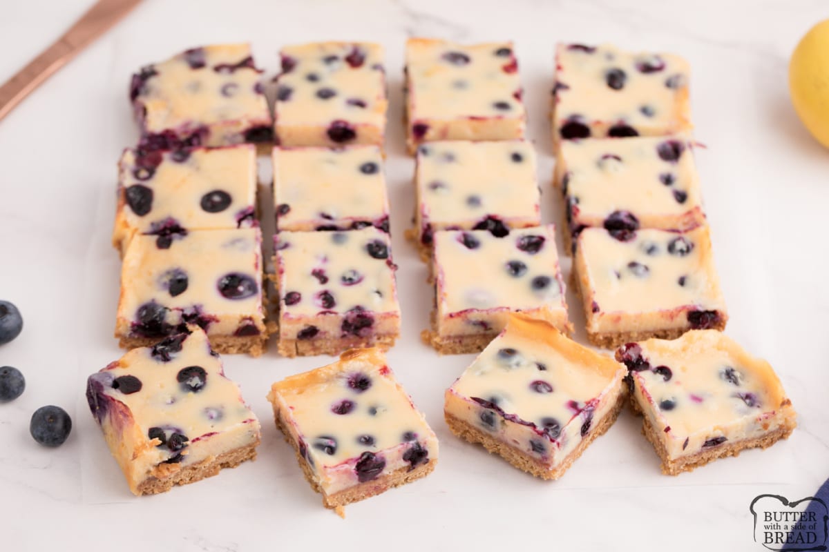 Blueberry Lemon Bars add a fun twist to the classic lemon bar recipe. The crust is made with graham cracker crumbs, which is topped with a creamy lemon layer filled with fresh blueberries.