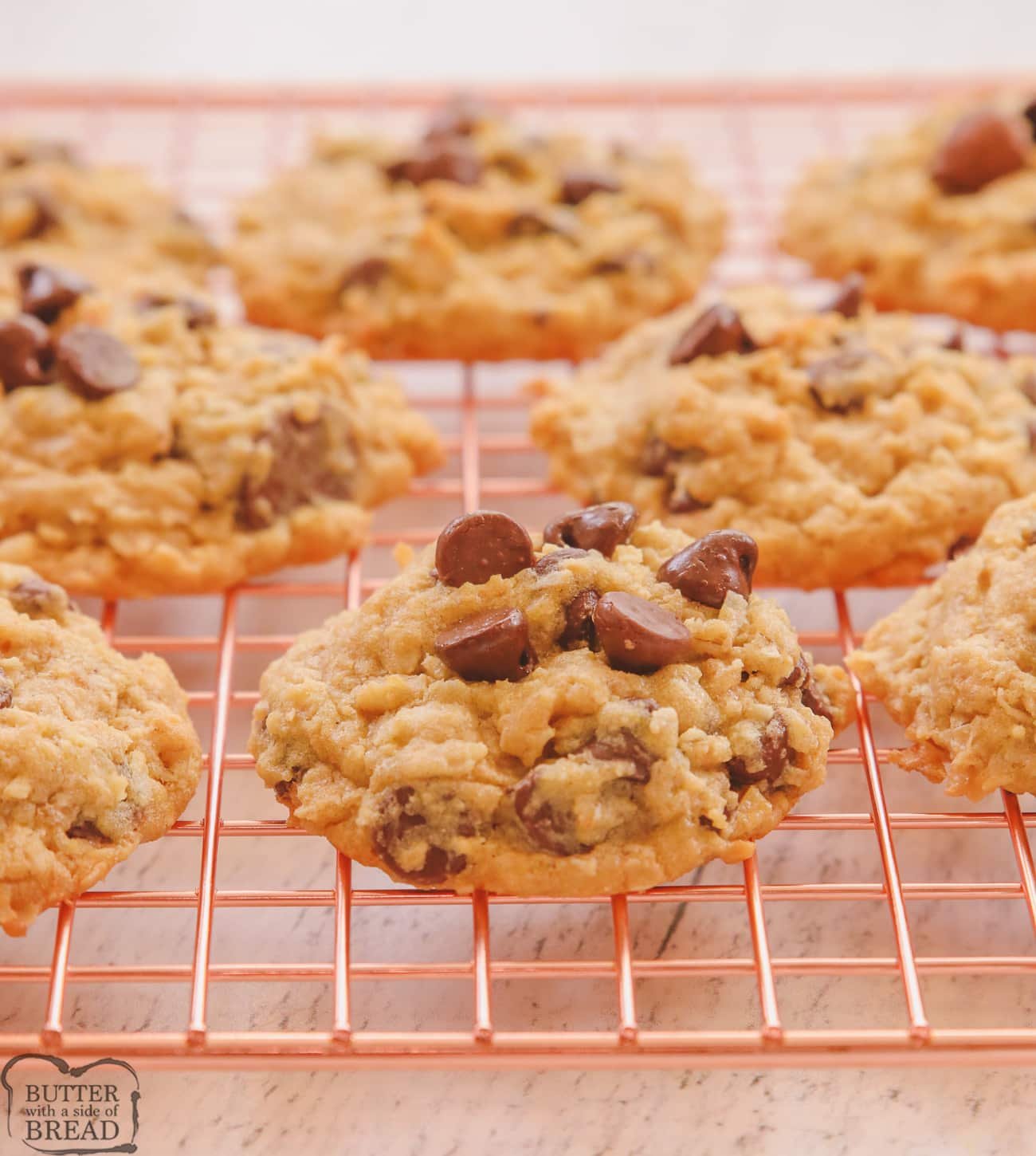 Oatmeal coconut chocolate chip cookies on a cooling rack