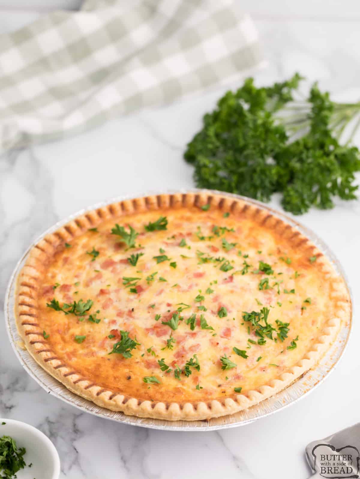Ham and Cheese Quiche is made with a simple pie crust, eggs, ham, cheese and milk. Only 10 minutes of prep for this delicious quiche recipe that is perfect for brunch or breakfast. 