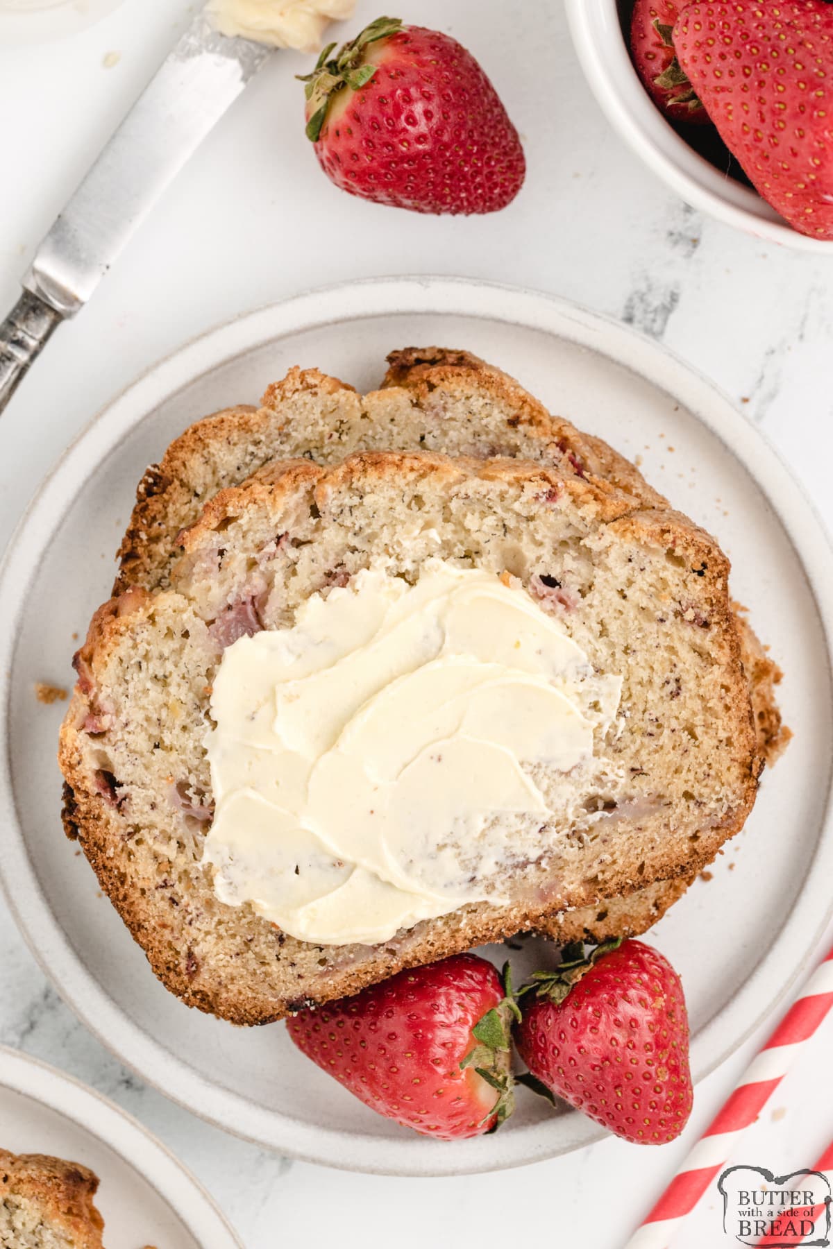 Slice of strawberry banana bread with butter 