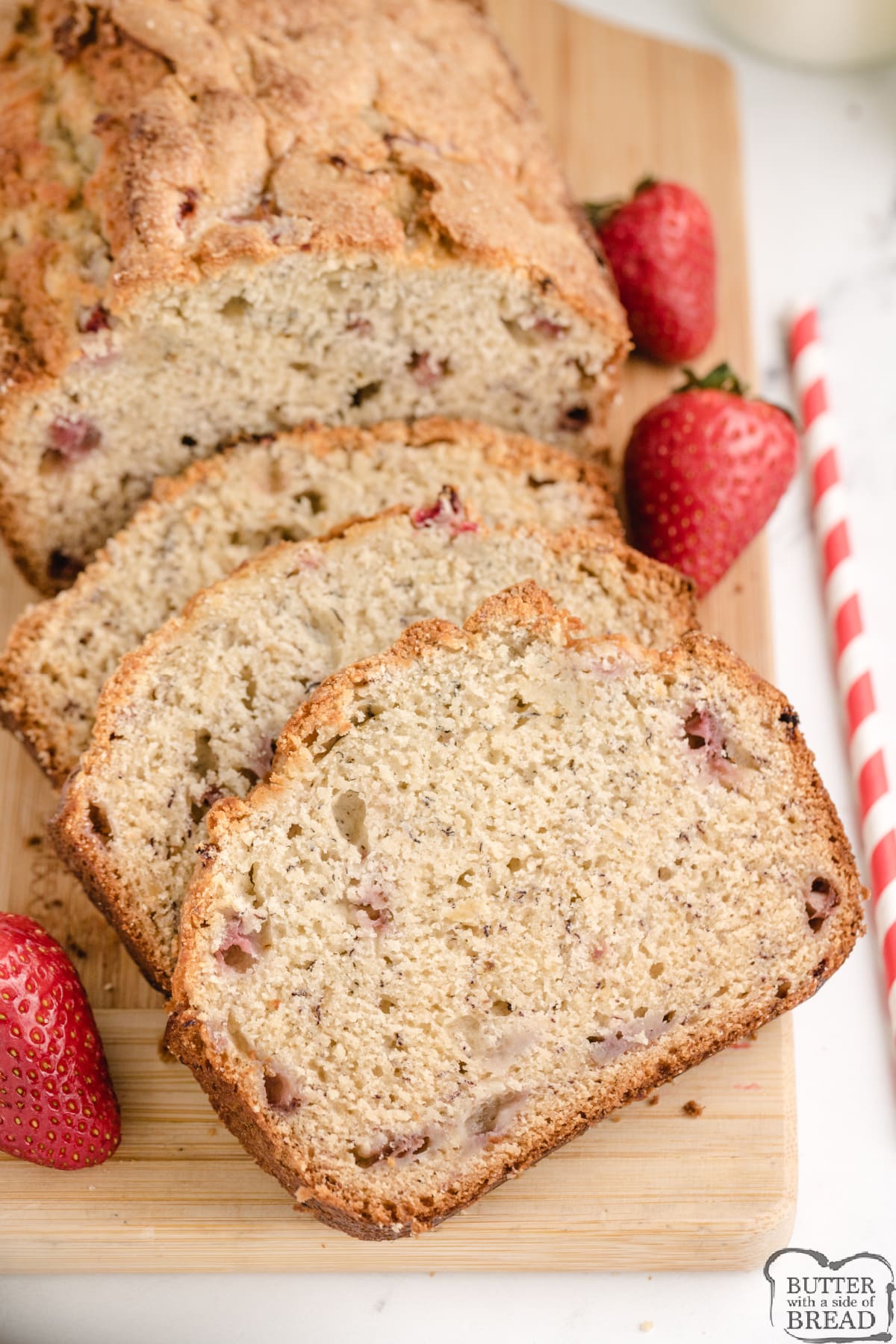 Sliced loaf of banana bread recipe made with strawberries