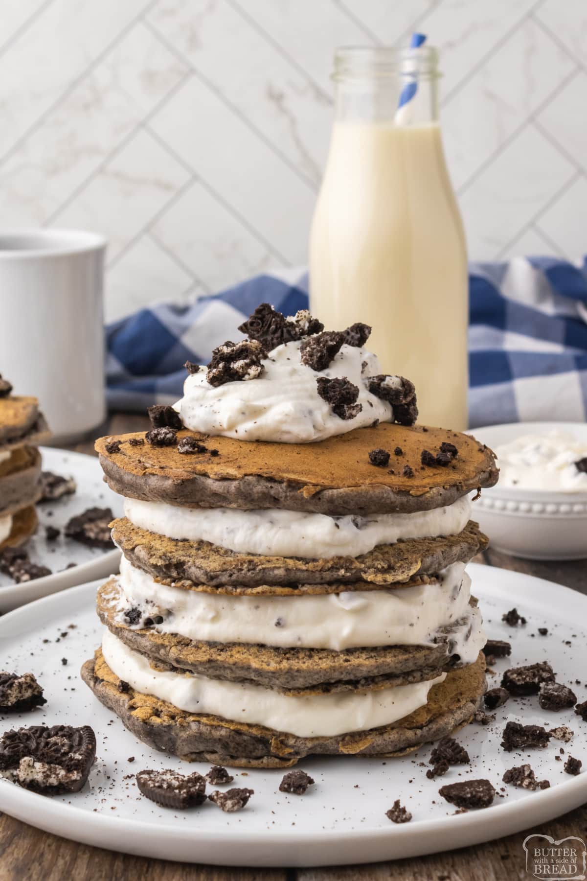 Stack of pancakes made with Oreos and whipped cream