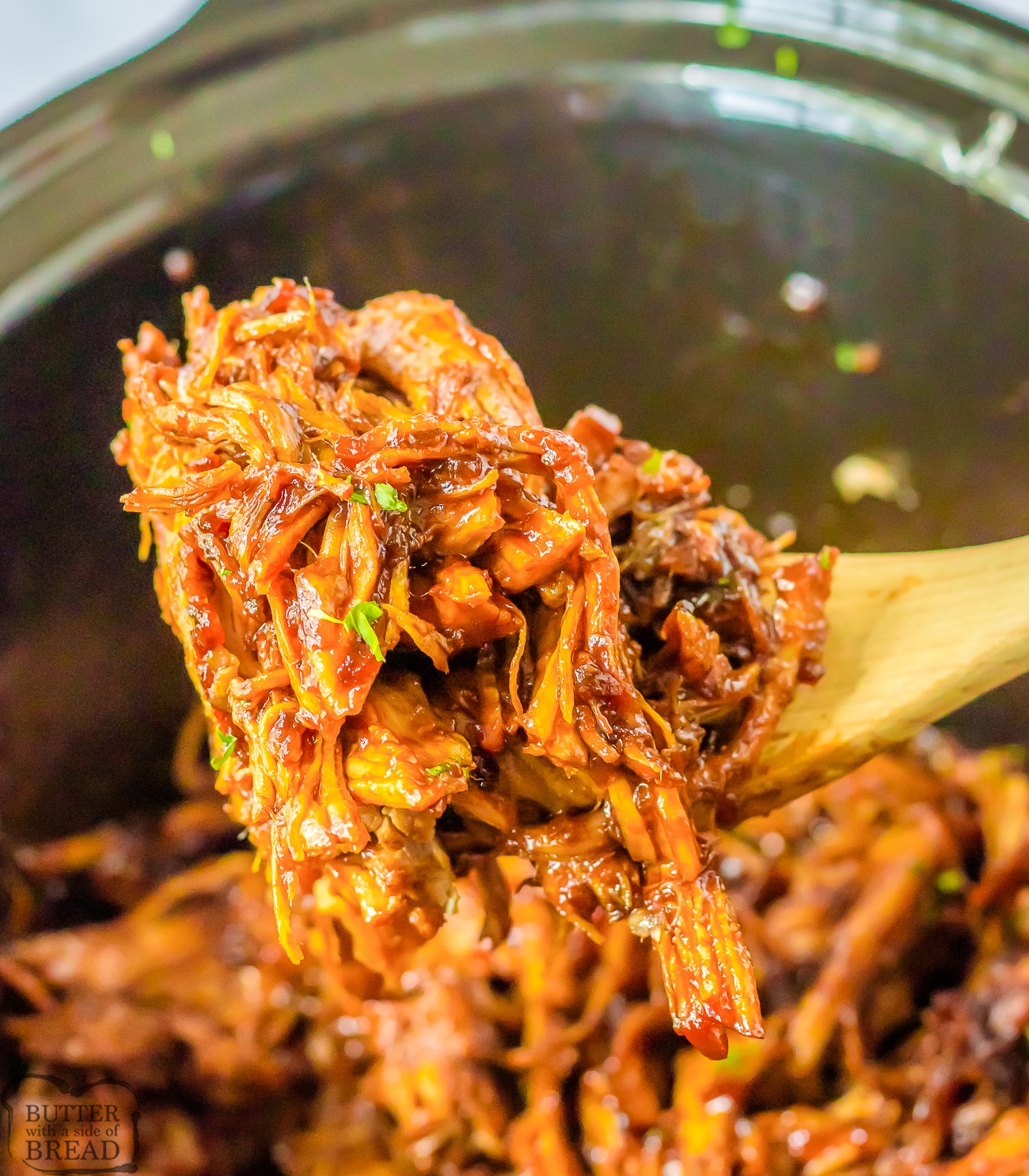 scoop of shredded pork loin made in a slow cooker