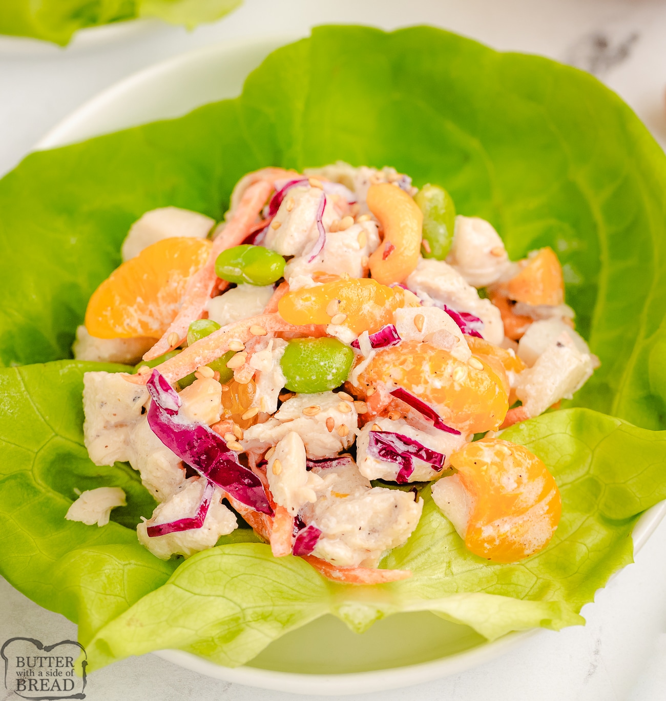 Asian chicken salad lettuce wrap with edamame and mandarin oranges